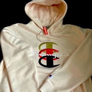 Supreme X champion LT pink Pullover Hoodie.